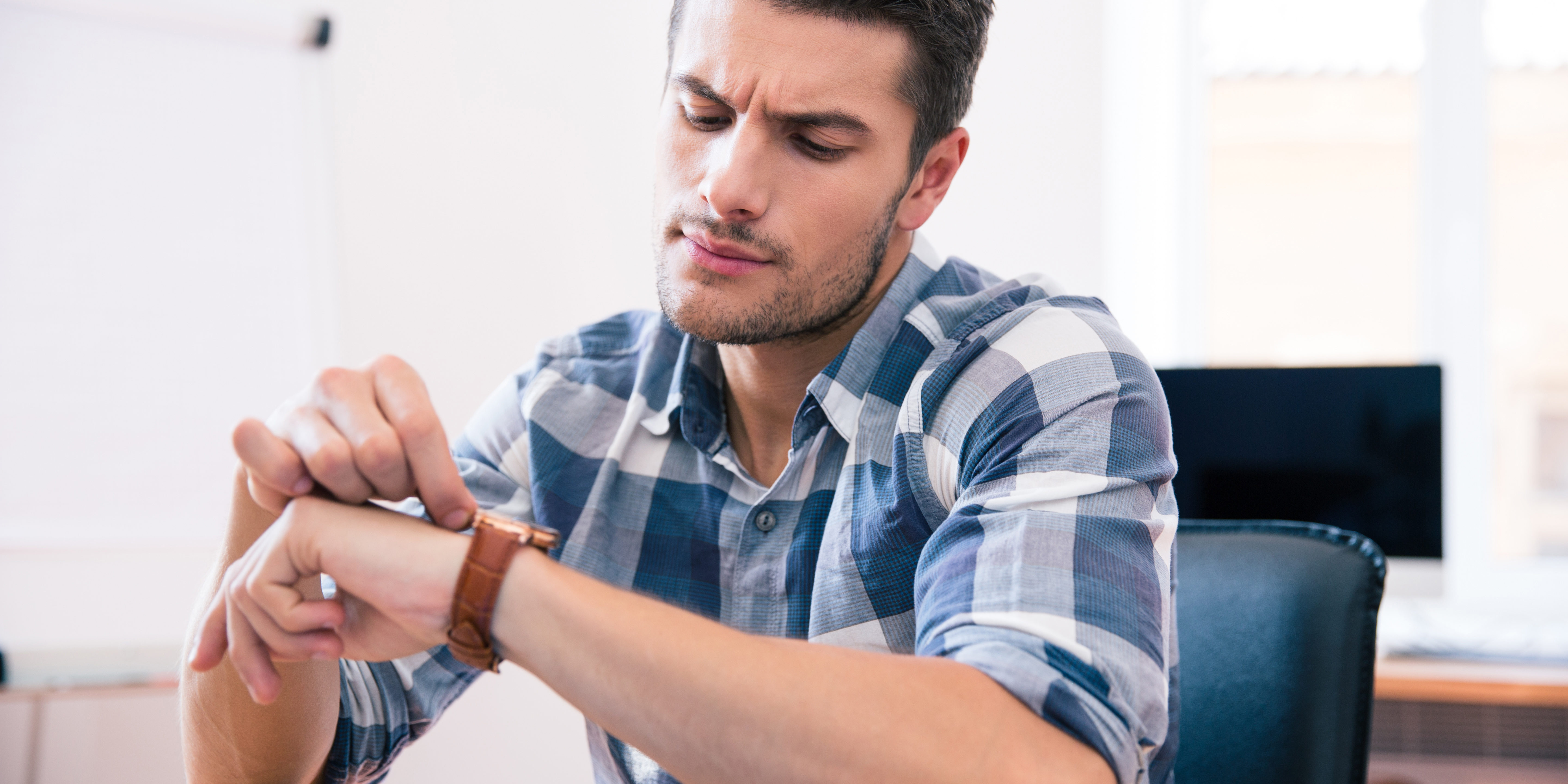 Handsome Young Businessman In Casual Cloth Looking On Wrist Watch